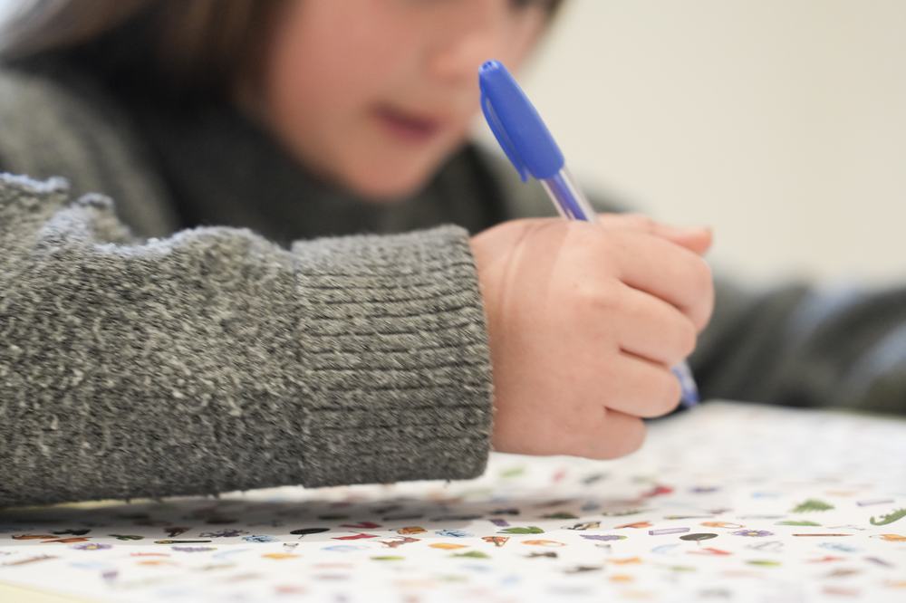 Close-up of a child completing an assessment activity